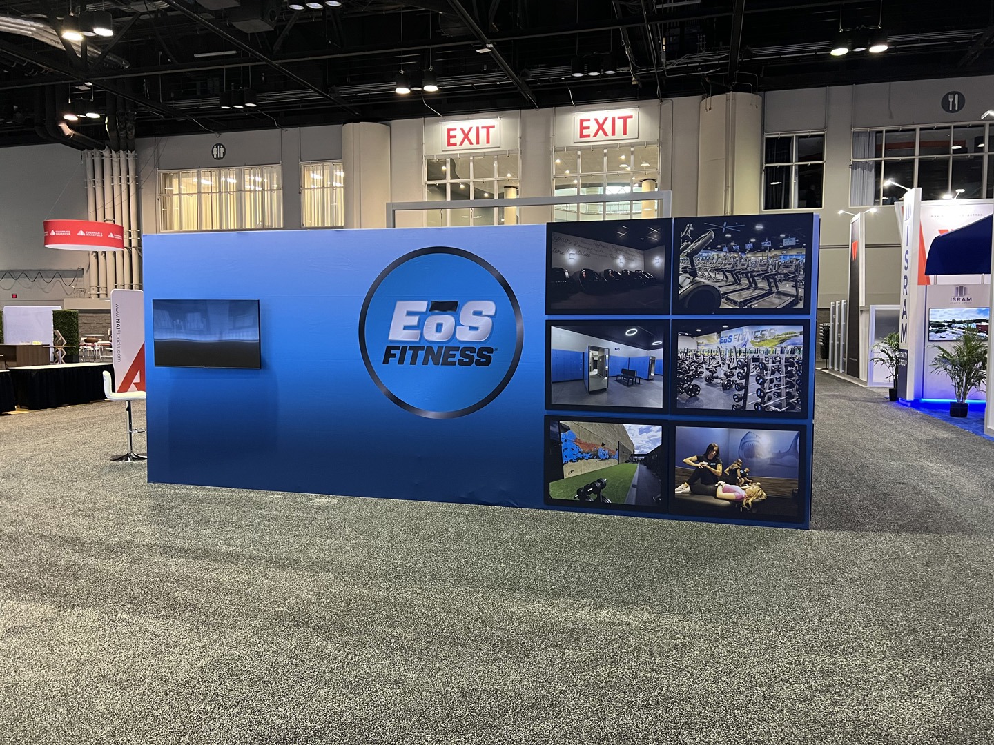 EOS Fitness banner stands, trade show exhibit custom display counters and more at ICSC Florida, made by TSD Counters.