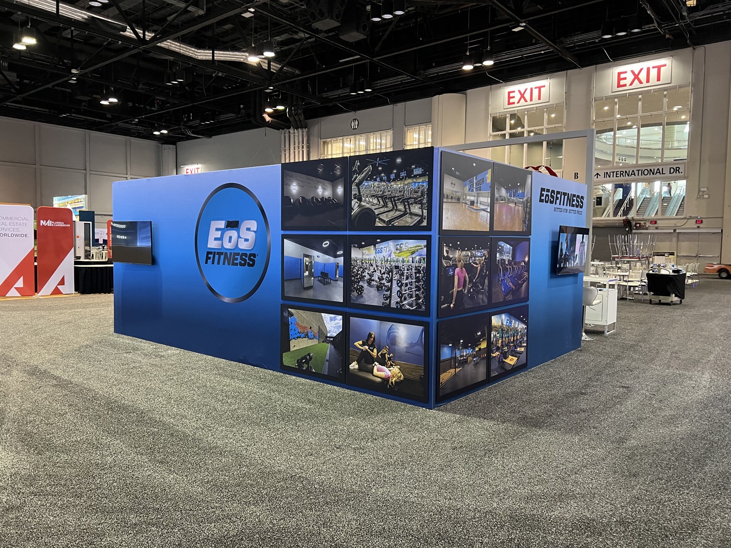 EOS Fitness banner stands, trade show exhibit custom display counters and more at ICSC Florida, made by TSD Counters.