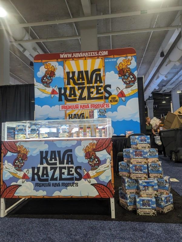 Image a custom trade show booth for of Kava Kazees Premium Kava Products. This features their business logo prominently with high-quality custom graphics and signs by TSD Counters in Southwestern Idaho.