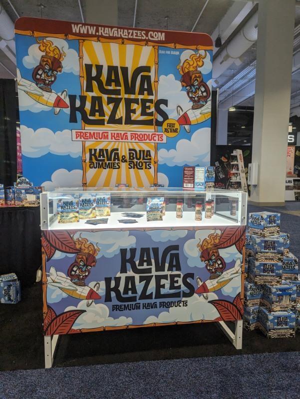 Trade show display counter for Kava Kazees, who sell gummies and bula shots of premium kava extract. This booth was designed and shipped by TSD Counters in Boise, Idaho.